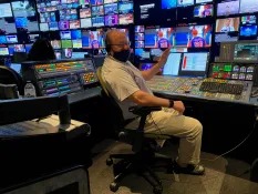 George Ruch at a production control room console