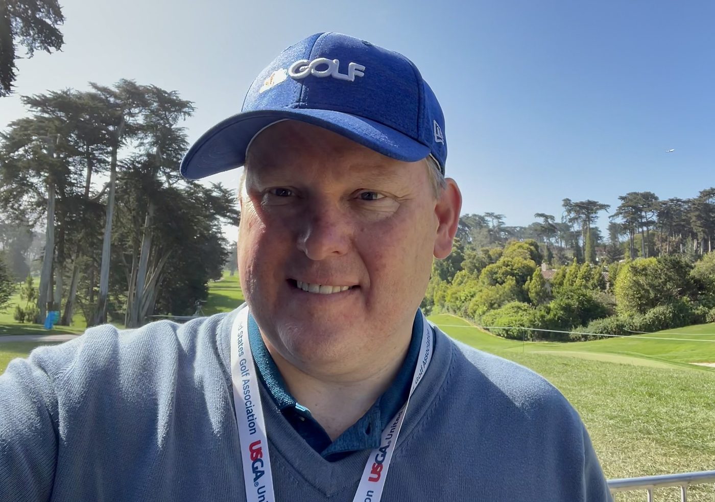 George Ruch in an NBC Golf hat on a golf course